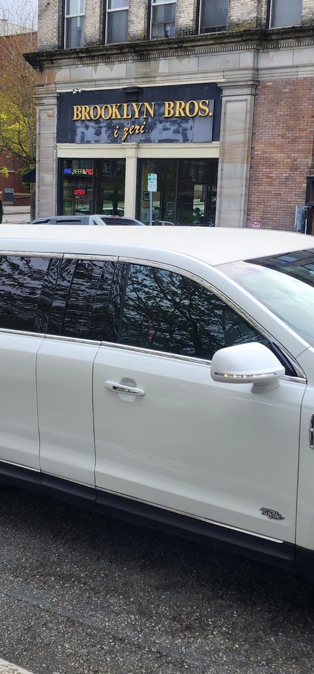 White stretch limousine in downtown Everett near Angel of the Winds Arena