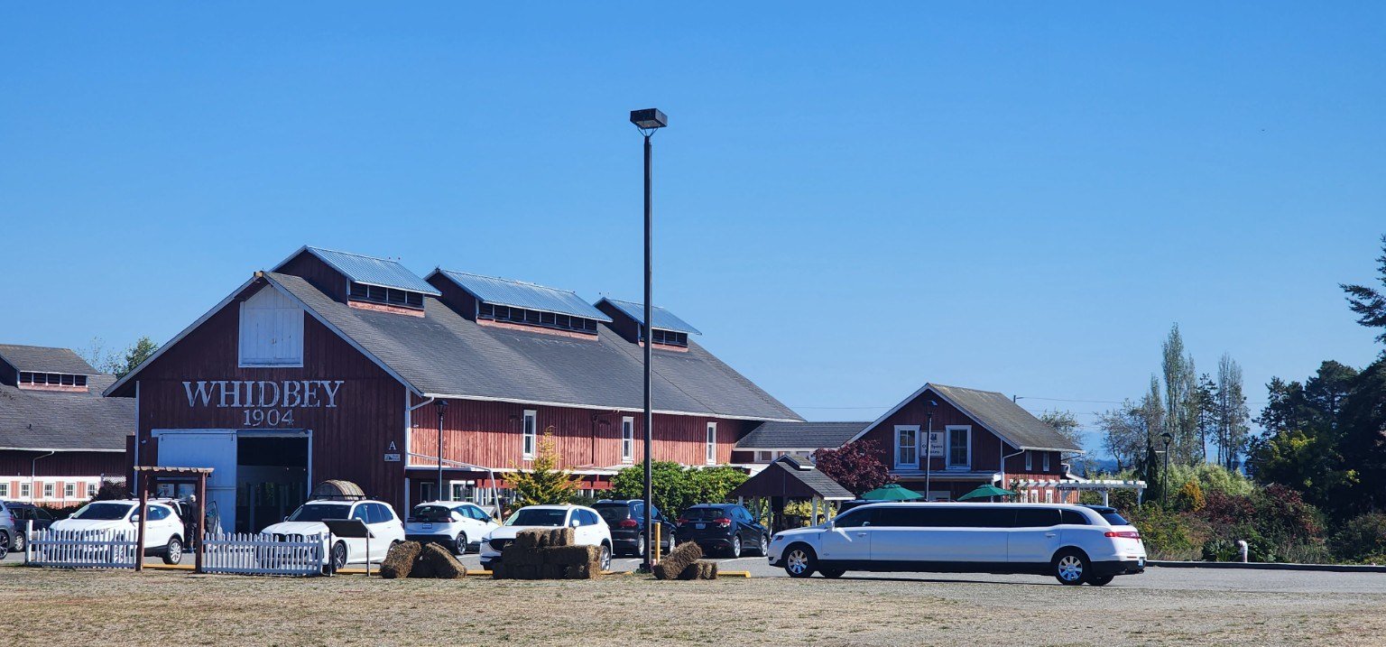White stretch limousine with a group at Greenbank Farm on Whidbey Island