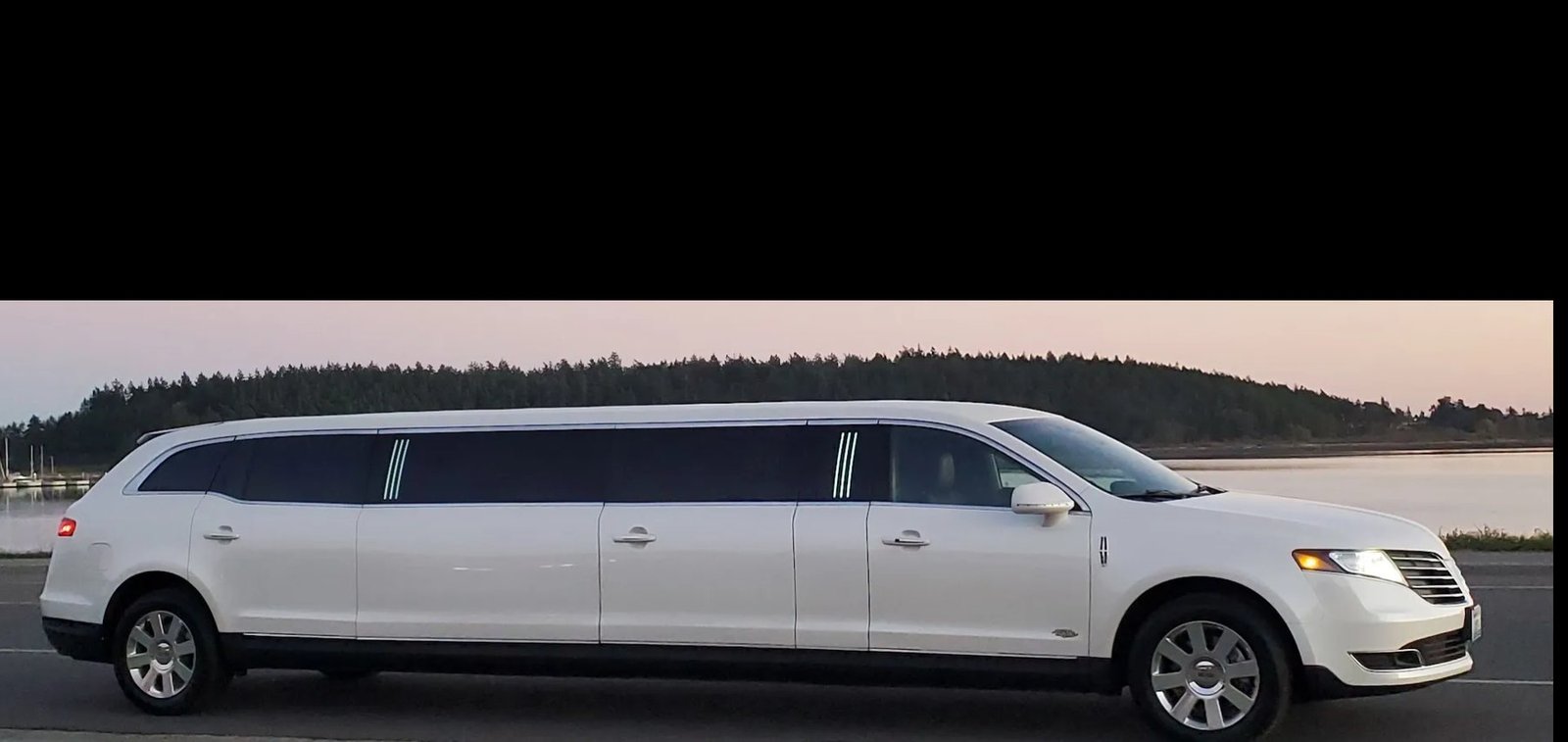 White stretch limousine serving Everett